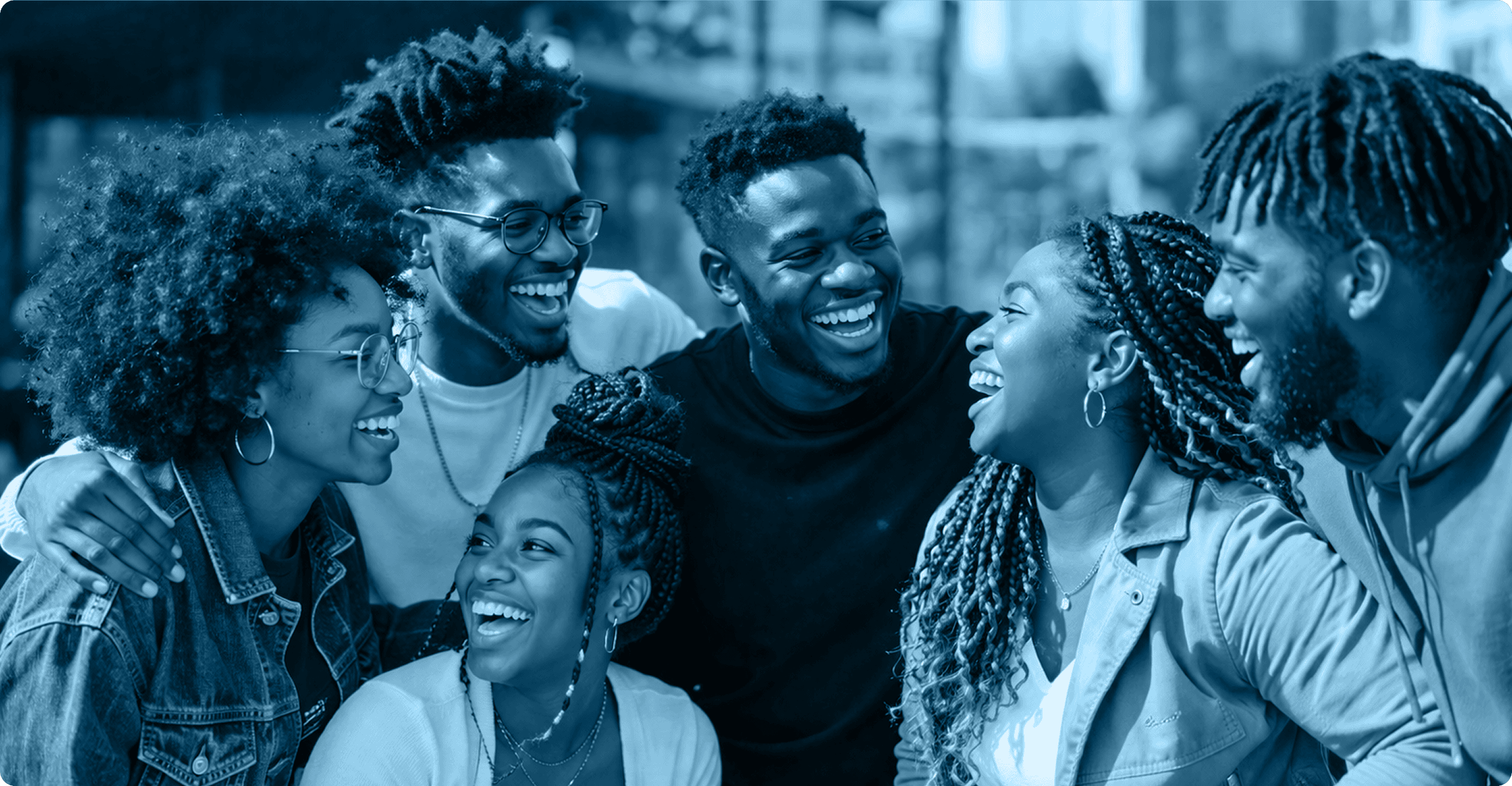 BTE community laughing together in an outdoor urban setting